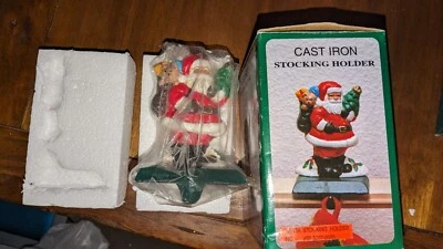 Cast Iron Mantel Stocking Holder Santa W/ Toy Sack & Christmas Tree Teddy Bear - Image 1 of 2