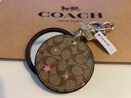 BORSA SPECCHIO COACH NUOVO CON ETICHETTE CIONDOLO IN TELA FIRMA CON STAMPA DISCO STELLA C6945