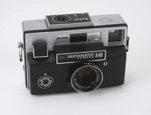 KODAK INSTAMATIC X-90, 38/2,8 EKTAR (POLVO, ESCOMBROS), ALGUNOS NÚMEROS/190570 - Imagen 1 de 3