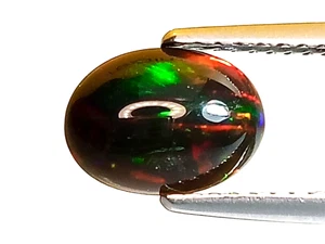 0.935CTS BLACK NATURAL ETHIOPIAN OPAL OVAL SHAPE  LOOSE GEMSTONES - Picture 1 of 2