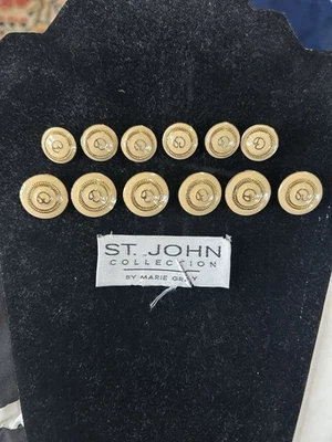 St John Vtg Goldtone Buttons, Beige Background. Six 1 In.; Six 3/4 In. Label Inc - Image 1 of 4