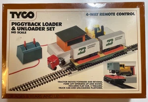 Juego de cargador y descargador Tyco HO Piggyback de colección control remoto de 4 vías nuevo en caja - Imagen 1 de 3