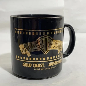 Movie World Warner Bros Gold Coast Australia Mug Cup Black Gold large 1991 - Imagen 1 de 4