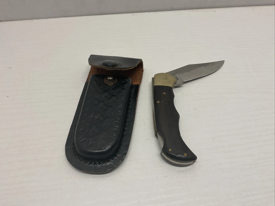 Navaja de bolsillo plegable de acero inoxidable vintage Solingen Bear Hunter estuche de cuero Foto 1 de 4