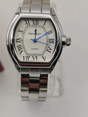  Reloj de cuarzo analógico para mujer Peugeot tono dorado con números romanos Foto 1 de 4