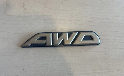 Subaru OEM 2000-2003 Outback Limited "AWD" Gold Rear Trunk Lid Emblem Logo Badge - Image 1 of 2