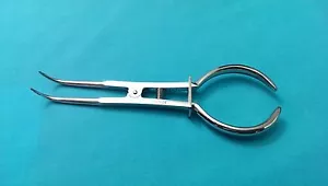 INSTRUMENTO QUIRÚRGICO DENTAL ABRAZADERA DE PRESA DE GOMA - Imagen 1 de 1