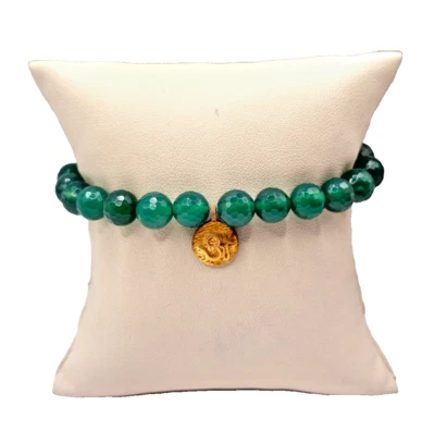 Pulsera elástica de cuentas verdes con dije colgante en espiral dorado Foto 1 de 4