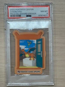 PSA 8 - CHARIZARD- 2023 POKEMON SENTER PIKACHU AWARD STICKER - Picture 1 of 2