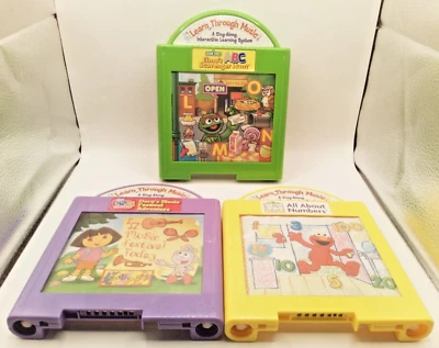 Lot of 3 Learn Thru Music Cartridges Dora's Hunt, Elmo's World, Elmo's Hunt - Image 1 of 4