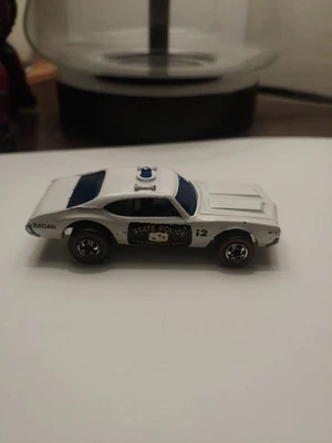 Hot Wheels Redline 1975  Police Cruiser Olds 442 Plastic Base State Police  - Image 1 of 4