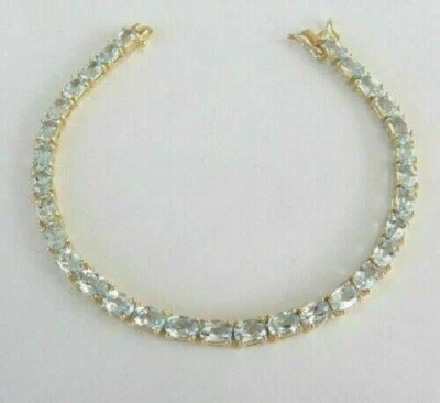 12Ct Oval-Cut Simulated Aquamarine Women Tennis Bracelet 14K Yellow Gold Plated - Image 1 of 4