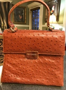 BOLSO DE MANO FRANCISCO ROGANI CUERO AVESTRUZ BRONCEADO con HERRAJES LOGOTIPO DE LATÓN - Imagen 1 de 10