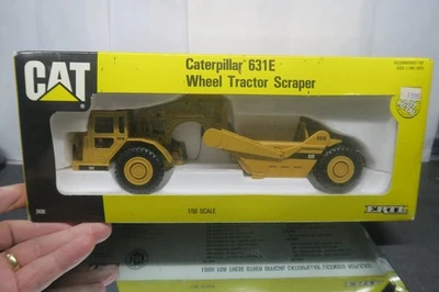 ERTL CAT #2430 ESCALA 1/50 CATERPILLAR 631E RUEDA TRACTOR RASCADOR ¡SIN USAR CON CAJA! Foto 1 de 4