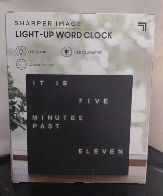 Sharper Image Light up Electronic Plug-In Word Clock, Black Finish w/LED Light - Image 1 of 4