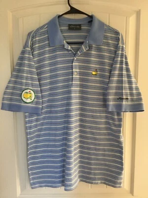 Polo de golf masters Collection azul dorado a rayas para hombre mediano con parche añadido Foto 1 de 4