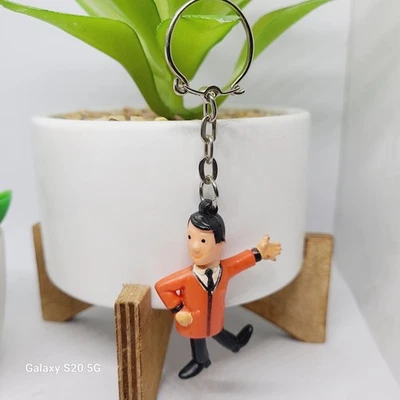 Chaveiro vintage Mister Minit novidade colecionável uniforme laranja - Imagem 1 de 4