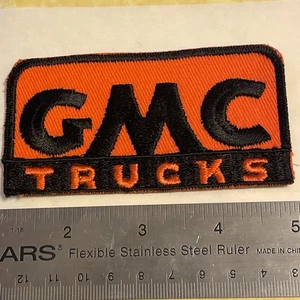 Vtg c 1980s GMC TRUCKS General Motors Truck Embroidered Patch Orange Black - Picture 1 of 6