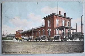M.C.R.R. Railroad Train Depot Horse & Carriages Vintage 1909 Postcard Jackson MI - Picture 1 of 3