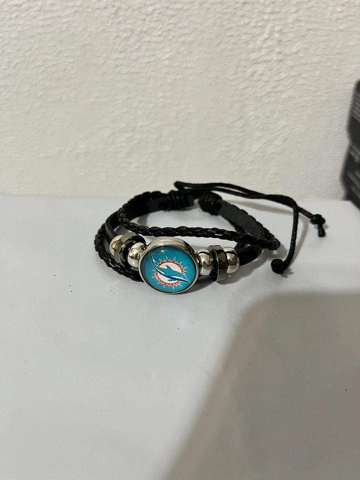 Pulsera de cuero negra de fútbol americano Miami Dolphins para hombre y mujer envío a Estados Unidos en 1 día Foto 1 de 1