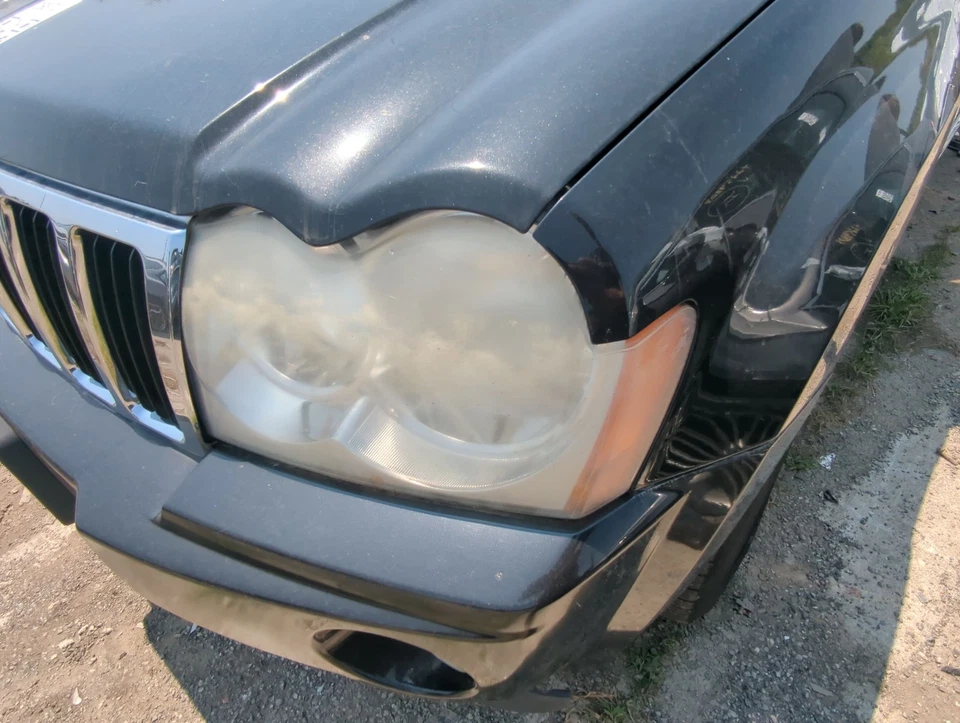 Jeep Grand Cherokee 2005-2007 conductor izquierdo OEM luz faro lámpara M89Y3 Foto 1 de 1