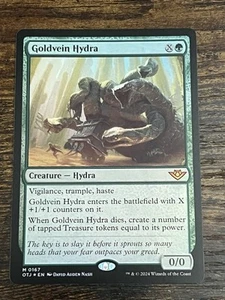 Goldvein Hydra (lámina) - Outlaws of Thunder Junction (OTJ) - EN M 0167 - Imagen 1 de 3