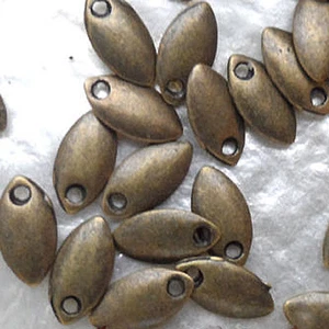 MINI CHARLOQUE - OVAL MELON SEED - BRONZE - 4.5/8MM - 1.5MM THICK - Picture 1 of 2