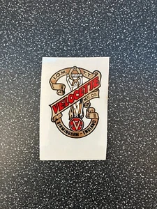 Velocette - 2 off vinyl self adhesive decal 45x55mm (Gold, Red & Black on clear) - Picture 1 of 1