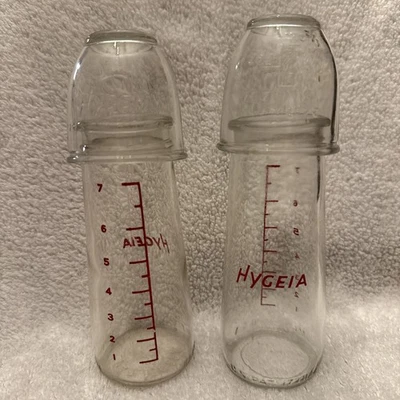 2 biberones de vidrio Hygeia vintage con marcas de medida con 2 tapas de vidrio Foto 1 de 4