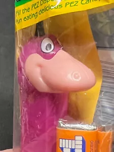 VINTAGE FLINTSTONES DINO DINOSAUR PEZ DISPENSER UNOPENED GREEN BAG - Picture 1 of 3