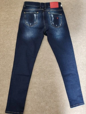 Pantalones de mezclilla azul envejecido con botones calce ceñido 31x30 Dsquared2 para hombre Foto 1 de 4