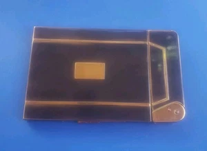 Encendedor de colección con estuche de cigarrillos Aladdin by Metalfield NY tono dorado/negro - Imagen 1 de 10