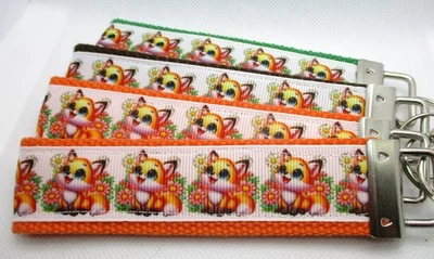 Zorros con Cinta de Flores en Fuertes Correas Llavero Llavero Muñequera Foto 1 de 4