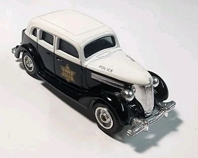 Coche de policía de plástico/diecast Ford Fordor vintage ERTL Dick Tracy '37 Disney Foto 1 de 4