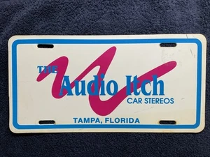 Letrero de matrícula vintage The Audio Itch Car Stereos - Tampa FL años 80 - Imagen 1 de 4