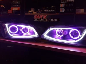Holden VE Commodore S2 Black DRL Headlights with Multicolored Halo Rings LED - Picture 1 of 5