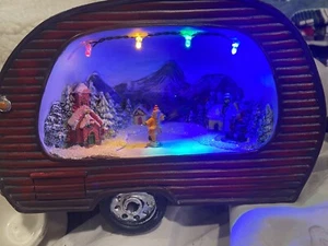 Christmas scene lighted child ice skating mountain cabin snow audience - Picture 1 of 6