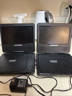 2-Sylvania SDVD7040B Portable DVD Player 1 AC Adapter, Swivel Monitor Used As Is - Image 1 of 4