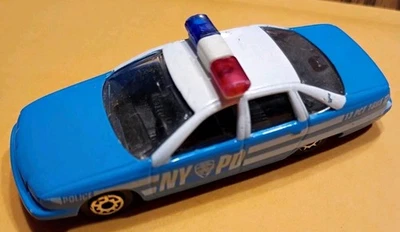 Maisto Chevrolet '91 Chevy Caprice NYPD Police Car 1:64 Scale Cruiser Light Blue - Image 1 of 4