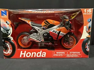 NUOVO RAY 49073 REPSOL 2009 HONDA CBR1000RR CBR 1000 RR BICI 1/6 ARANCIONE PRESSOFUSO - Foto 1 di 18