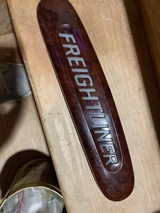 FREIGHTLINER EMBLEM LOGO 18-31915-000 PLASTIC SIMULATED WOODGRAIN GOOD SHAPE - Picture 1 of 9