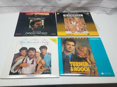4 Laserdisc Movies Turner & Hooch Dances W/ Wolves Three Men & A Baby Camelot M1 - Image 1 of 4