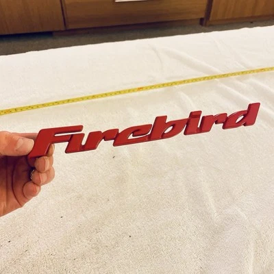 Placa de identificación con emblema de letra de puerta roja Pontiac Firebird 1993-2002 transmisión automática Foto 1 de 4