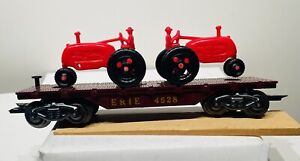 Marx No. 4528 ERIE Maroon Flatcar with Red Tractors