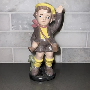 Vintage Boy Figurine With Tan Coat W/Cap Holding Horn Satchel. - Picture 1 of 9
