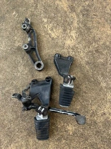 YAMAHA VMAX 1200 1989 LEFT & RIGHT FOOTRESTS, BRACKETS, REAR BRAKE CALIPER BRAC - Picture 1 of 2