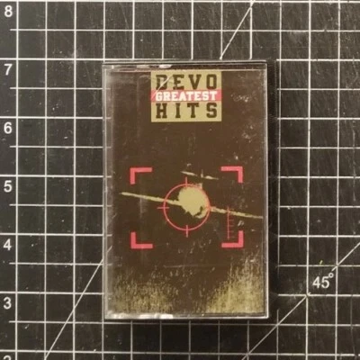 DEVO Greatest Hits CASSETTE 1990 TAPE VG+/VG+ MARK MOTHERSBAUGH Brian Eno CASALE - Image 1 of 4