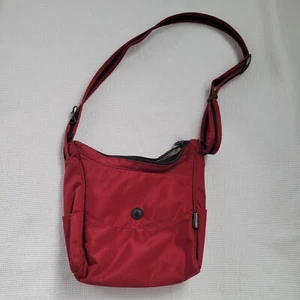Borsa a mano PACSAFE Citysafe CS100 rossa a tracolla RFID antifurto Exomesh nylon - Foto 1 di 12