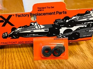 AFX / AURORA / ORIGINAL NEW OLD STOCK ~ TIRE SET OF 4 ON CARD / NOTHING BETTER!! - Picture 1 of 1