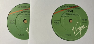 DEVO * BEAUTIFUL WORLD / THROUGH BEING COOL * 2X 7" SINGLES BOTH PLAY GREAT - Image 1 of 2
